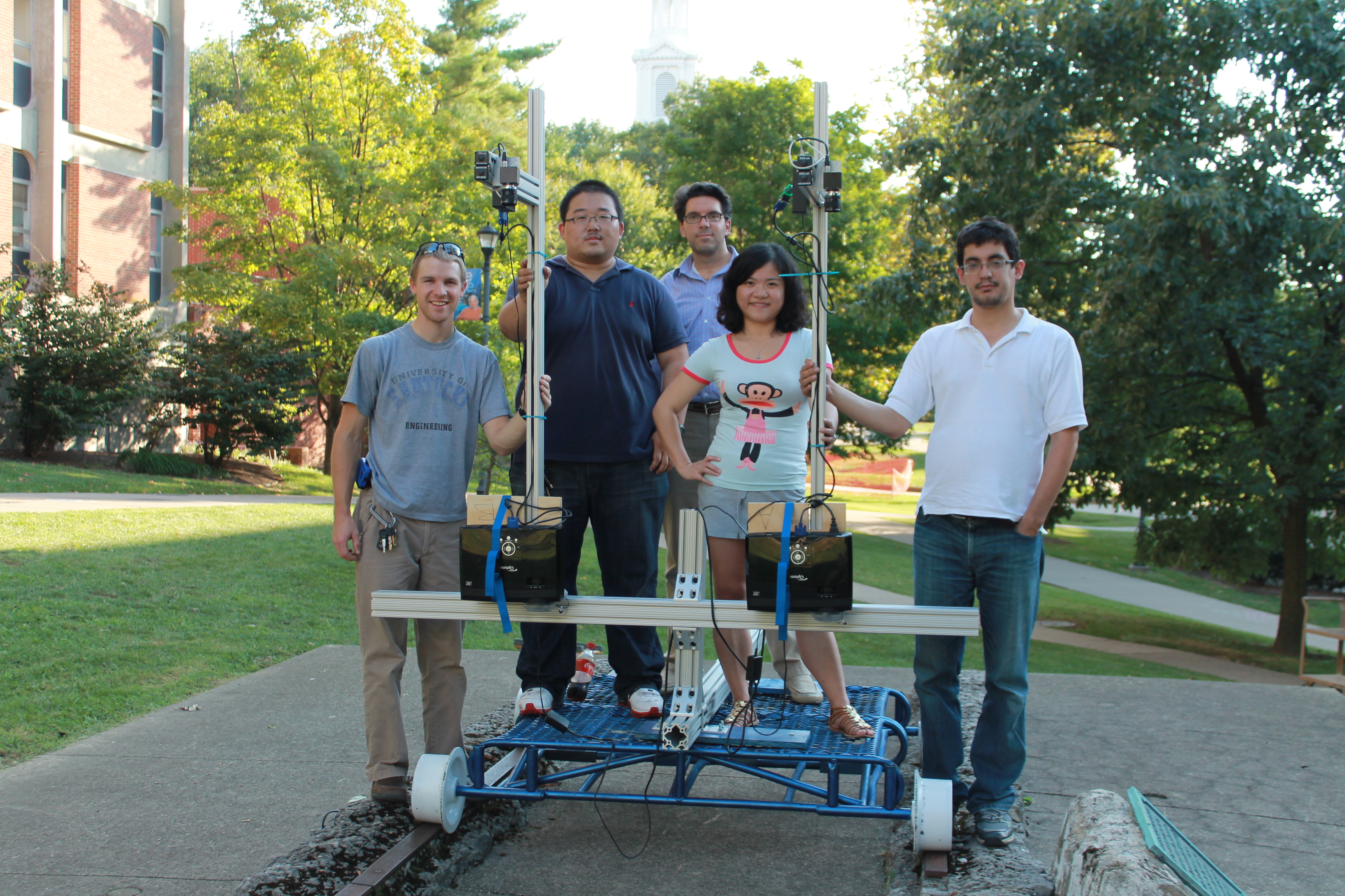 Student engineering team with the dual-projector structured light scanner built for 3D scanning of railroad track crossings